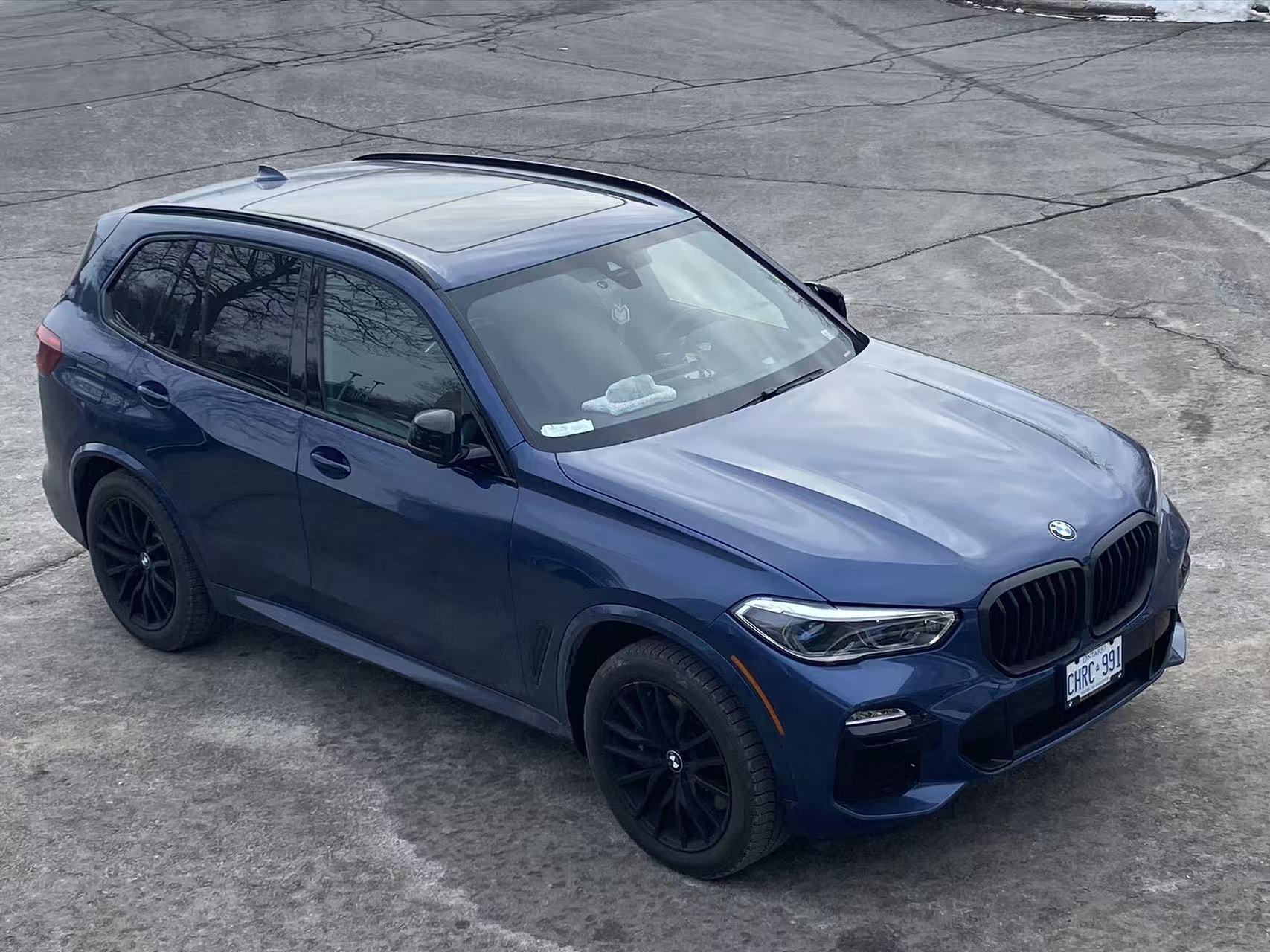 Blue BMW parked outside